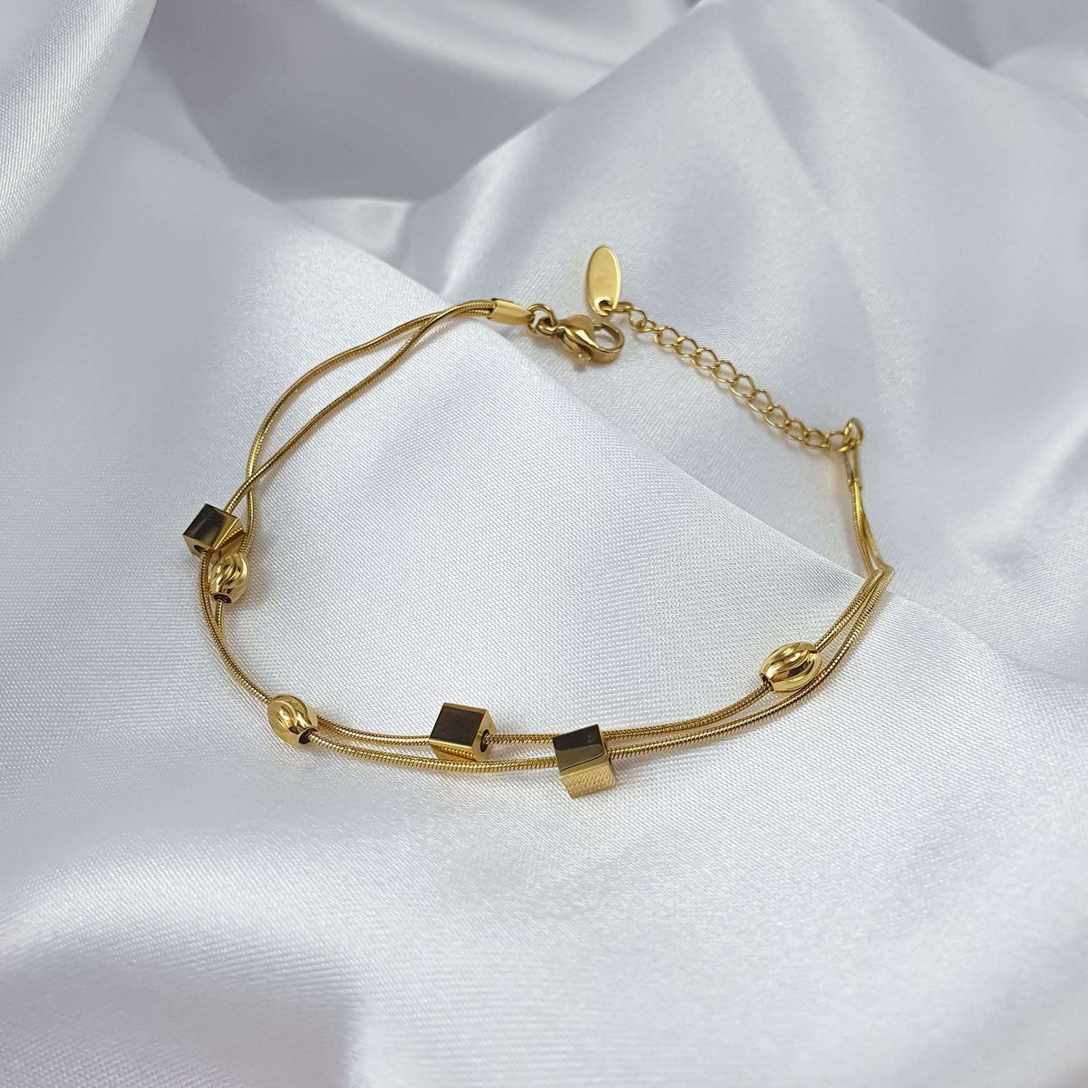 Bracelet with square and oval links, showing the lobster clasp and extender