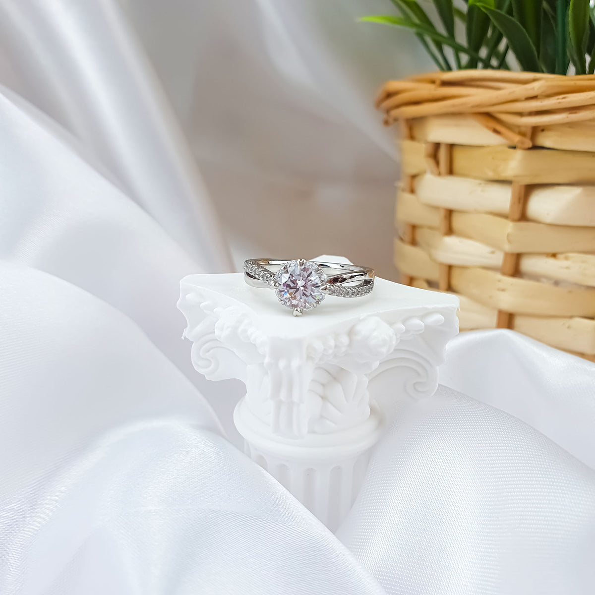 Sparkling cubic zirconia ring on a white decorative column