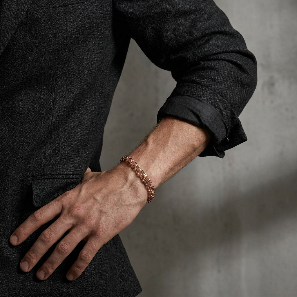 Wide Garibaldi bracelet in a gold tone on a man's wrist