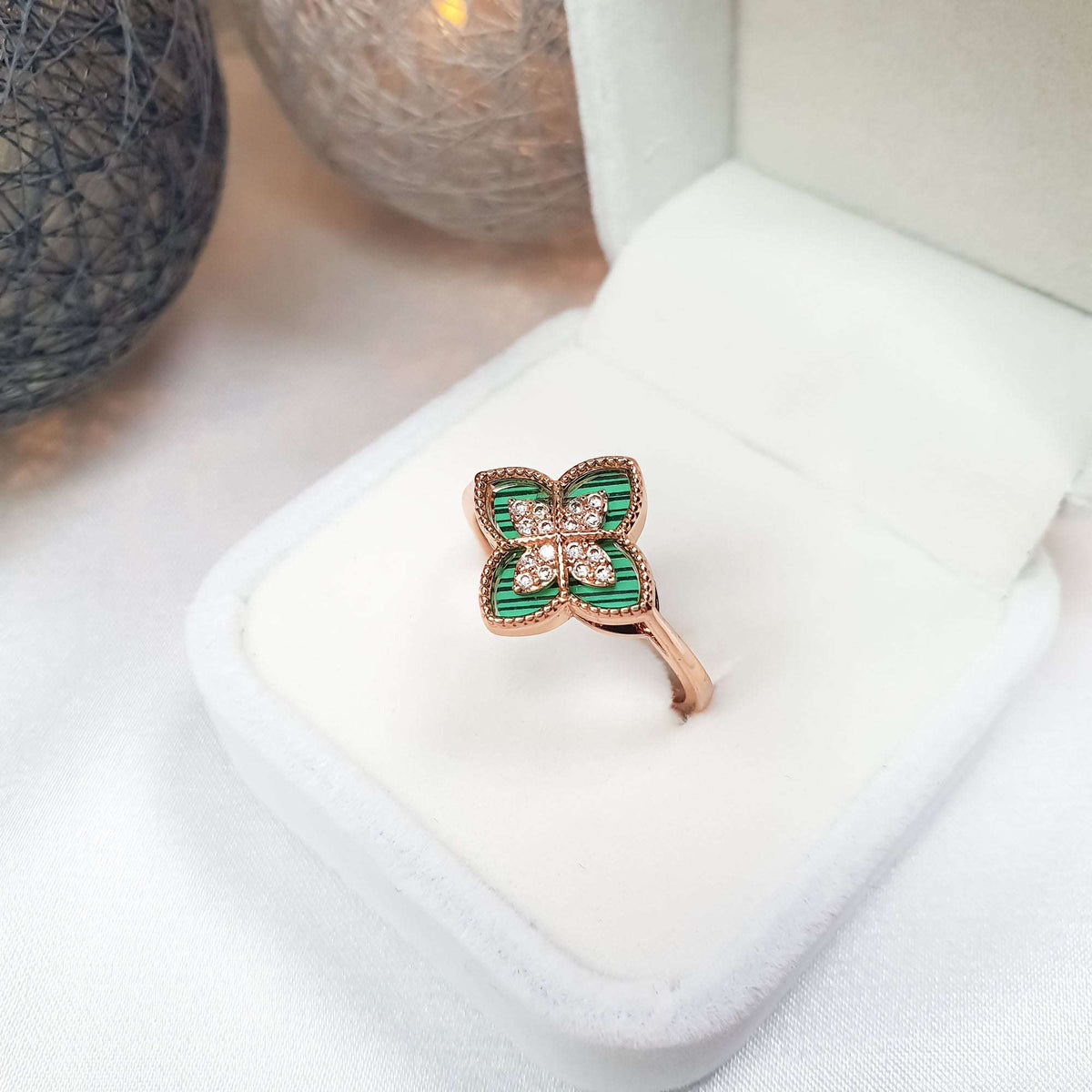 Green clover ring with cubic zirconia in a white gift box