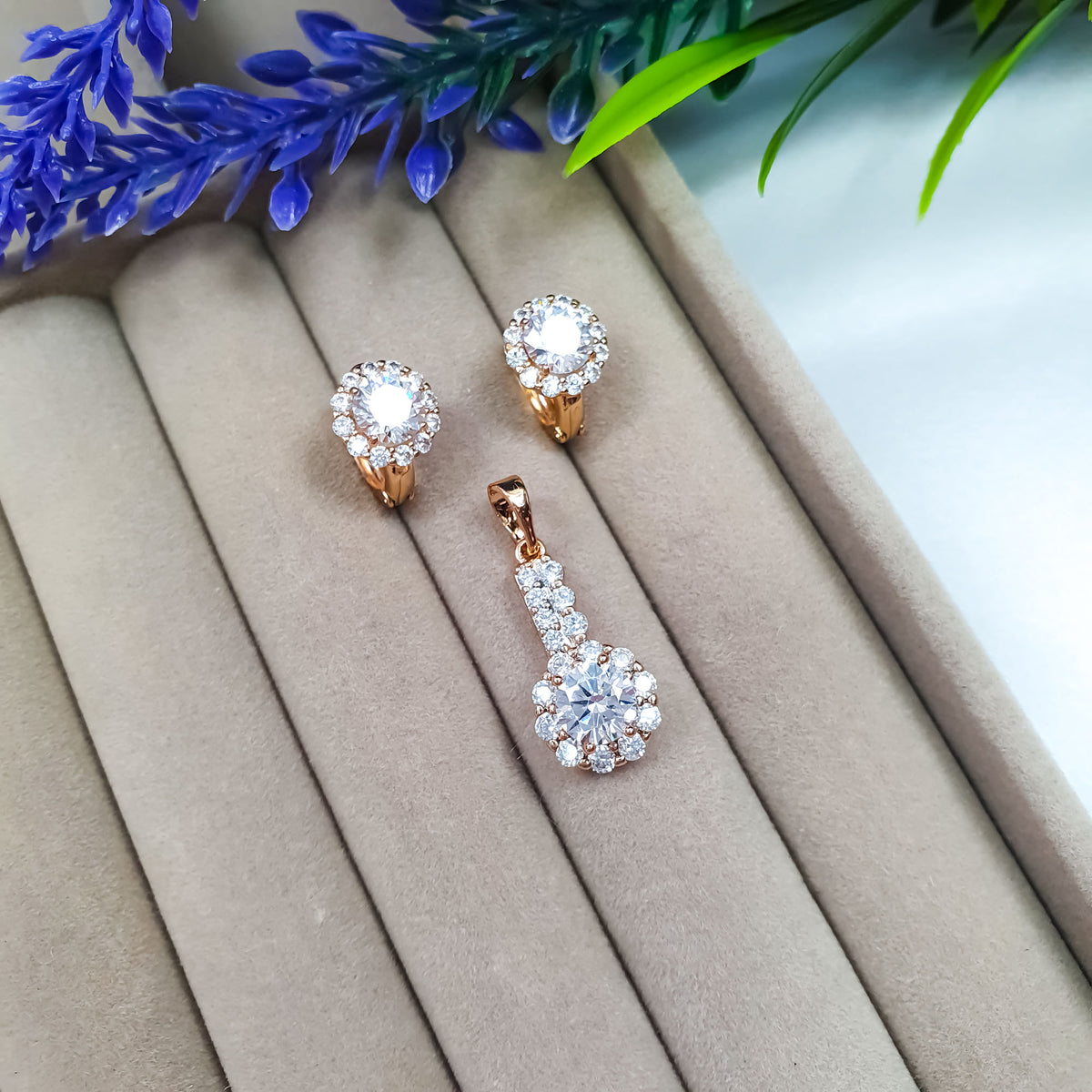 Gold-tone earring and pendant set with clear cubic zirconia in a velvet box