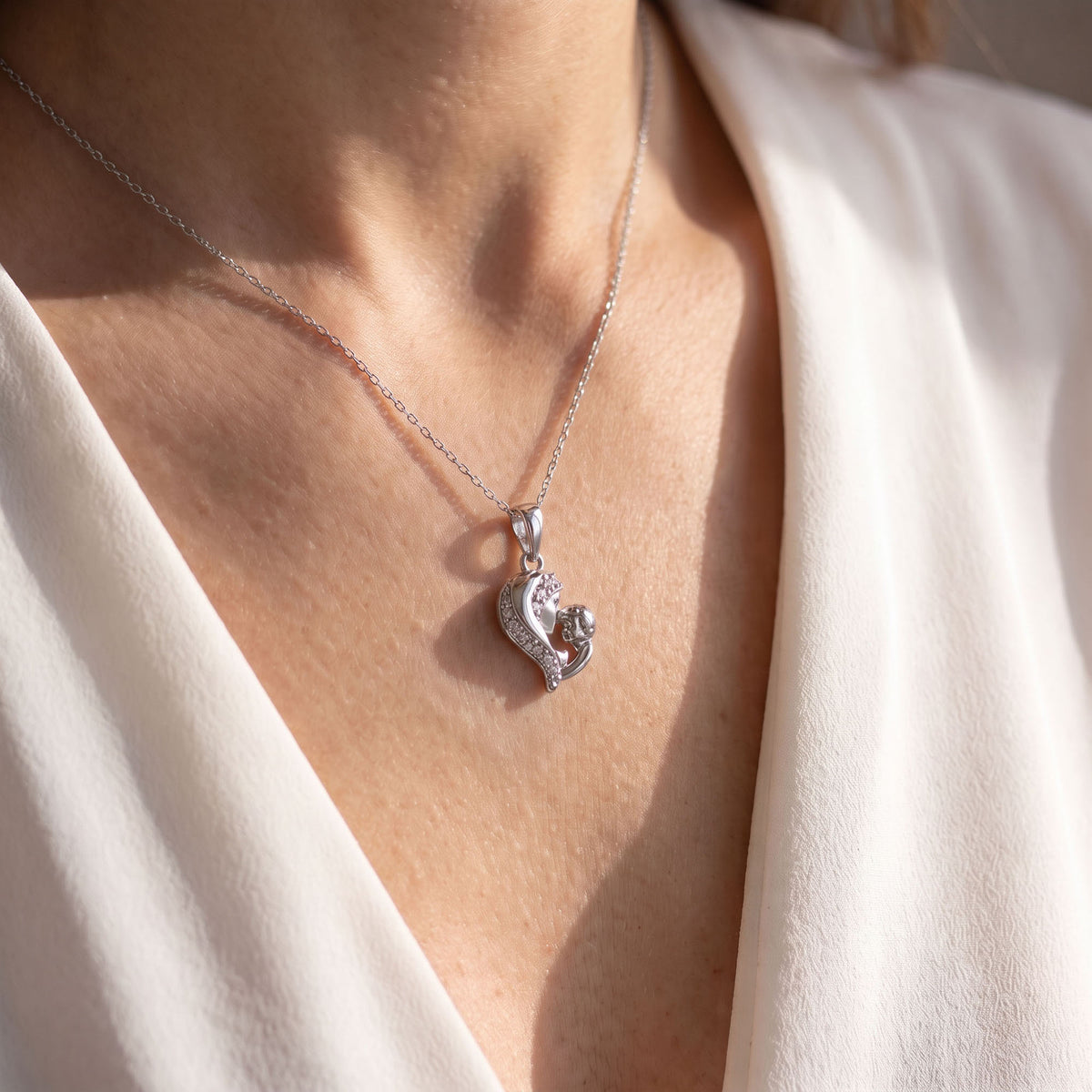 Silver | Platinum-plated mother and child pendant set with small clear cubic zirconia