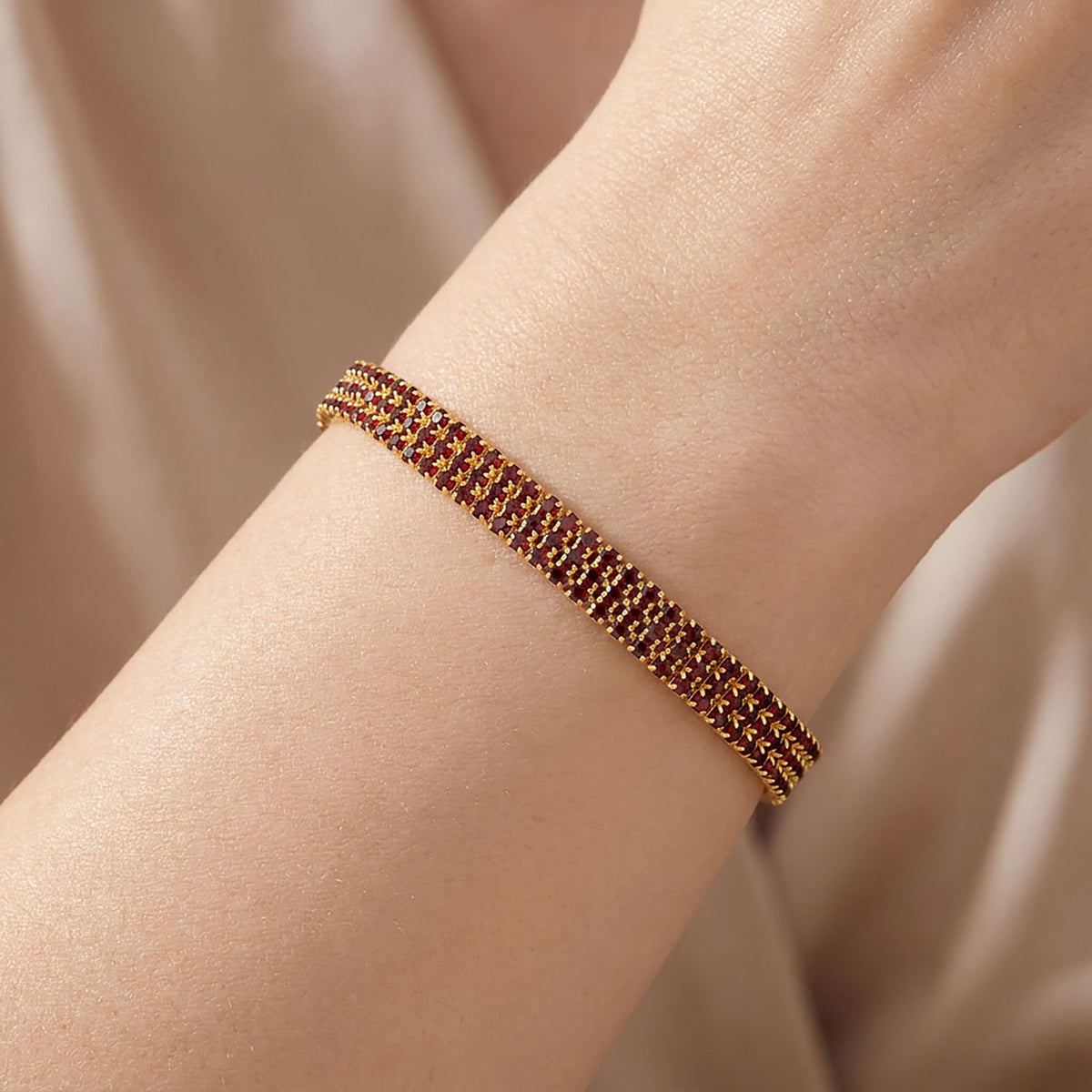 Evening bracelet with red cubic zirconia
