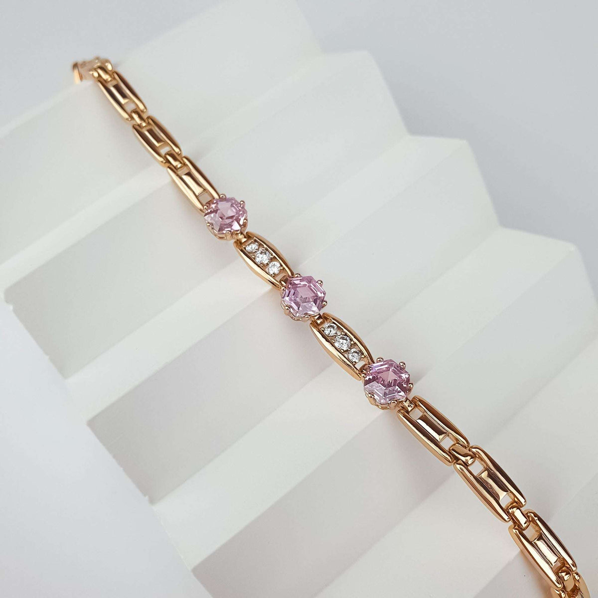 Close-up of the pink crystal bracelet, hexagonal stones and cubic zirconia links