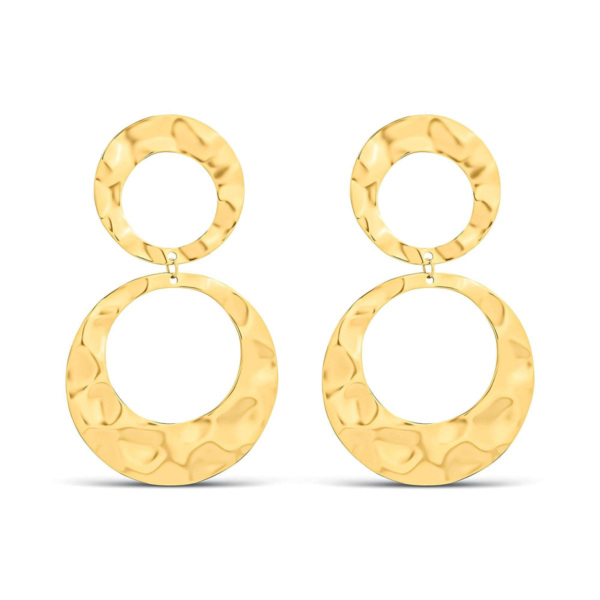Large gold-plated earrings made of two hammered metal rings on white