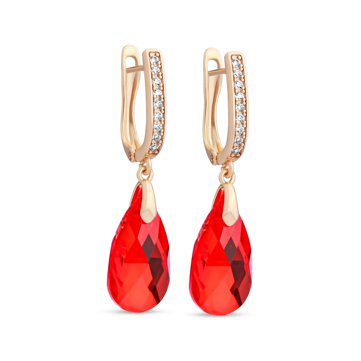 Gold-plated earrings with red teardrop crystals and a row of clear zirconia on white