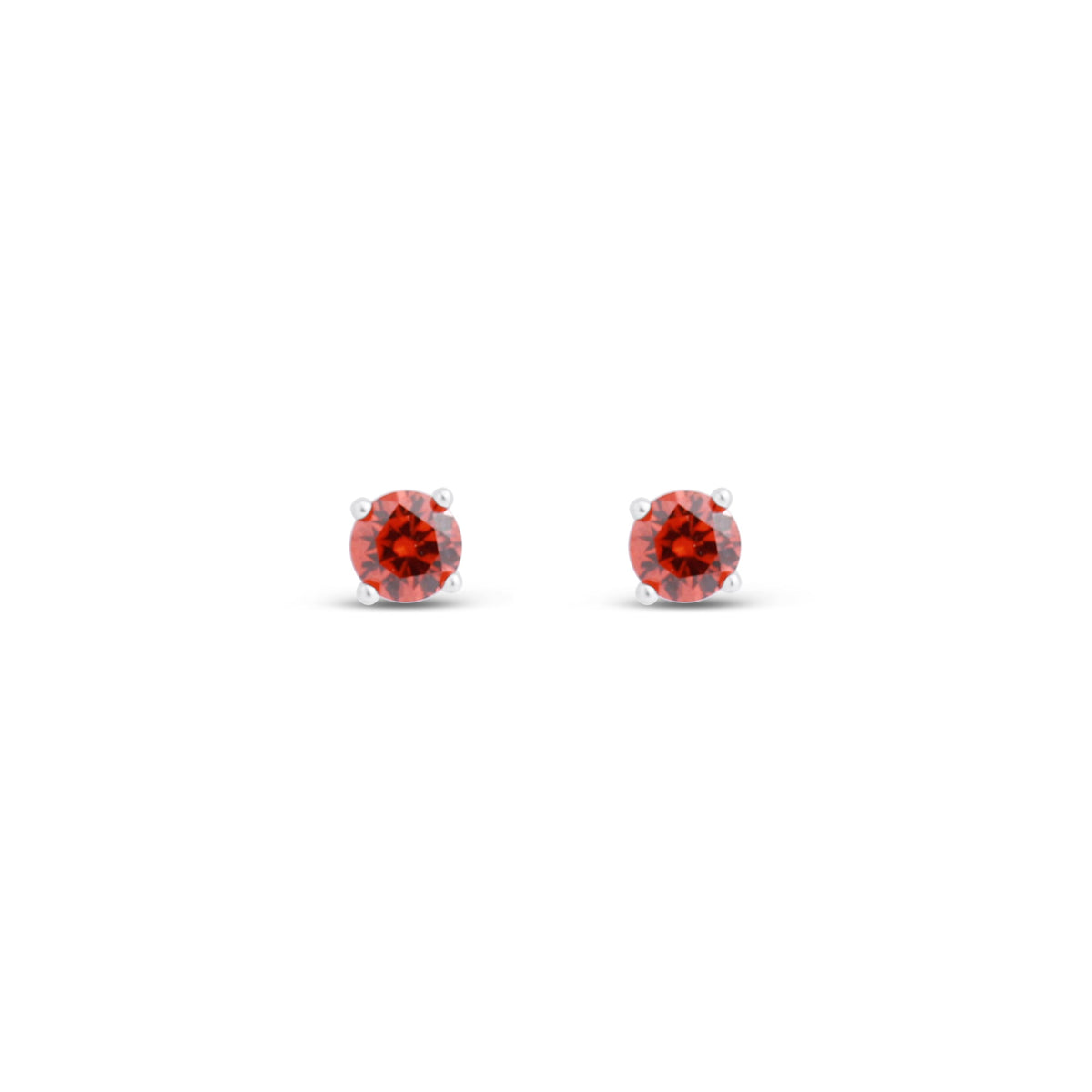 Round red crystals close up in shiny silver-tone stud settings