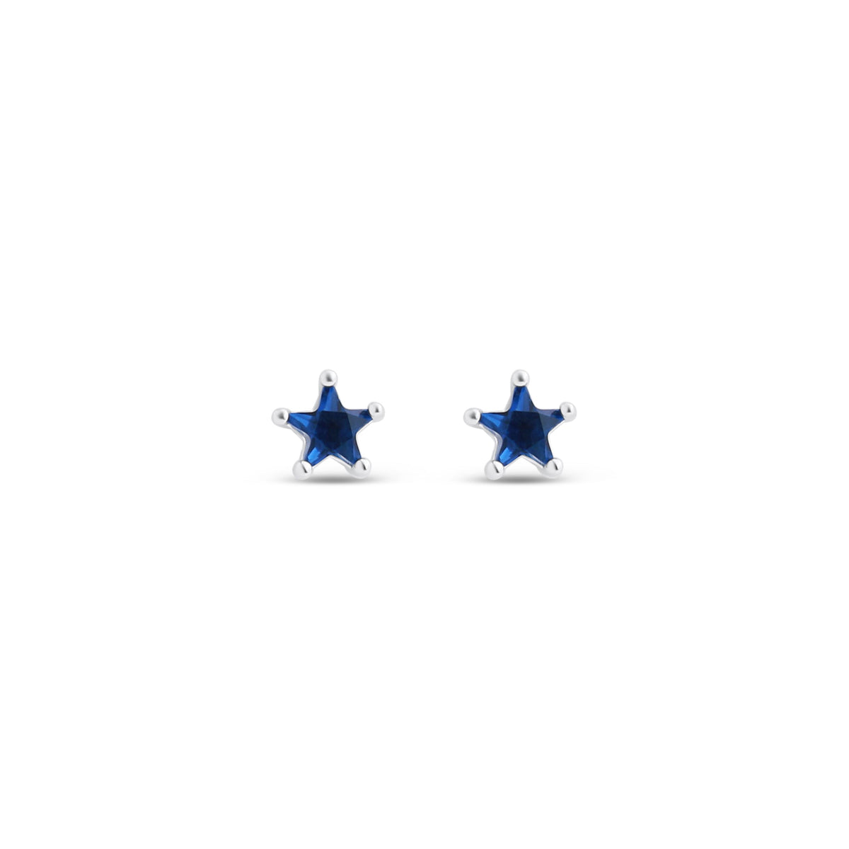 Star-shaped stud earrings with dark blue crystals in silver tone