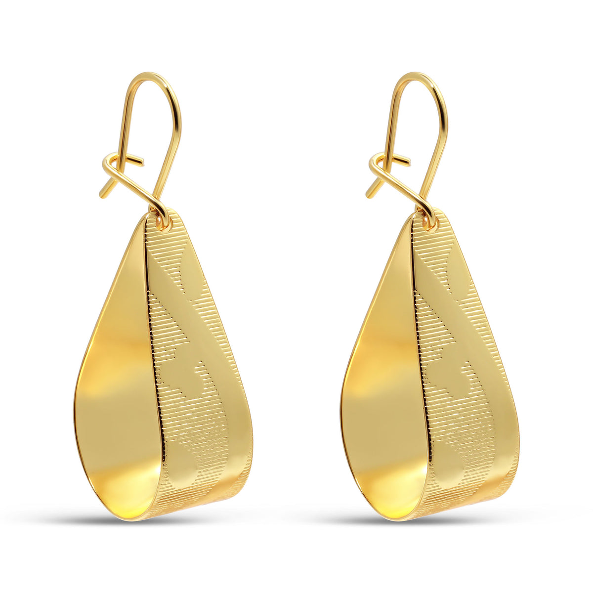 Long gold-plated earrings with raised ridges and fish hooks on white