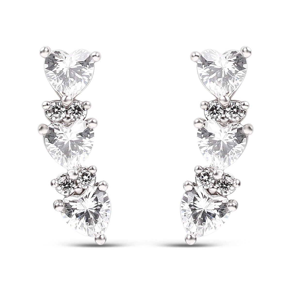 Platinum-tone earrings with three heart-shaped cubic zirconia in a gentle curve