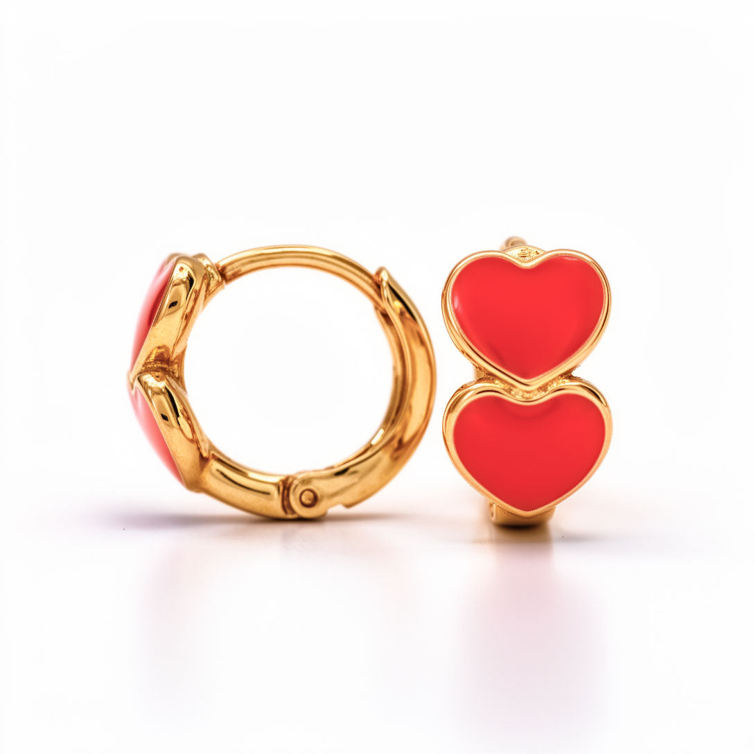 Small 12 mm hoop earrings with two red enamel hearts in a gold-plated frame