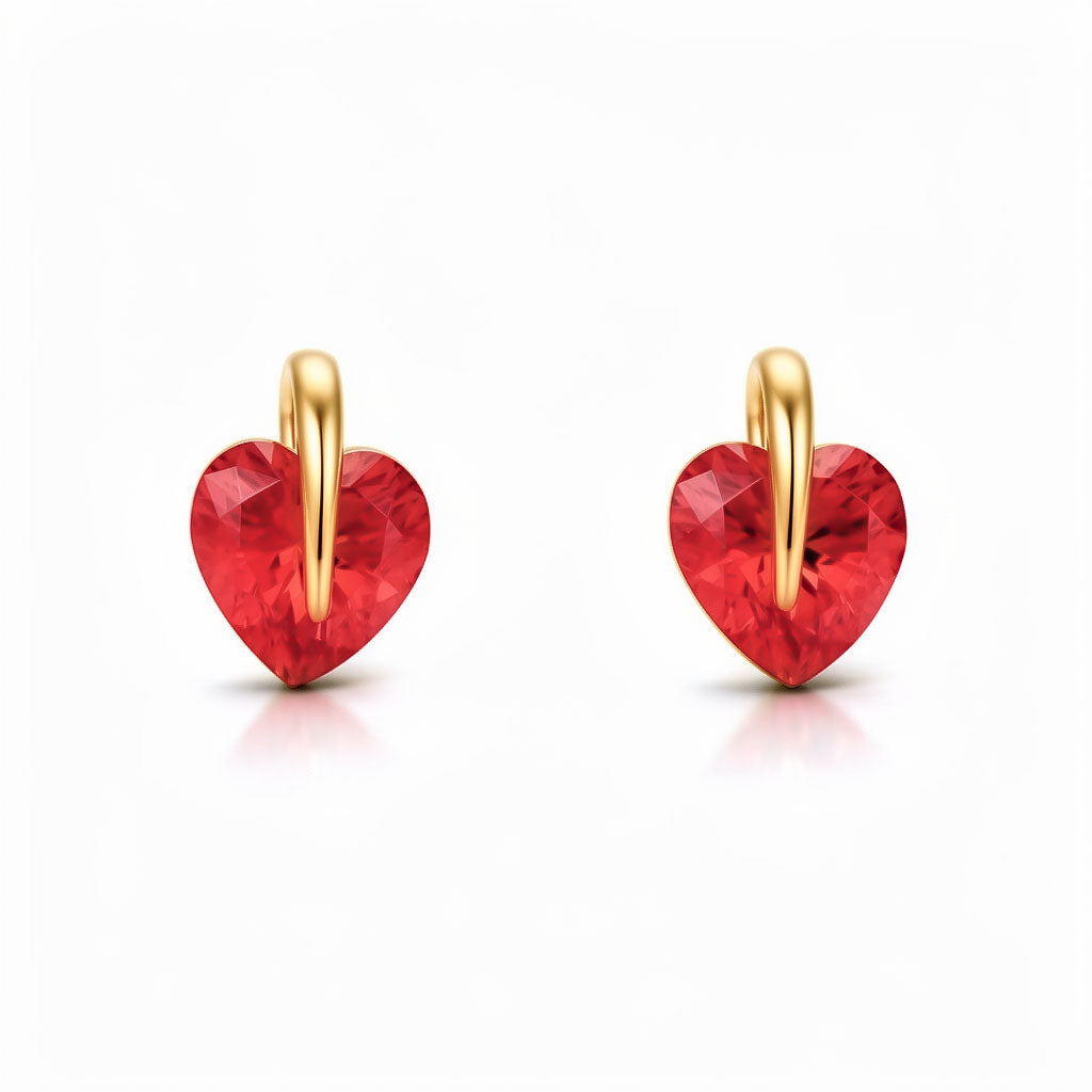 Red heart-shaped cubic zirconia in gold-tone settings on a white background