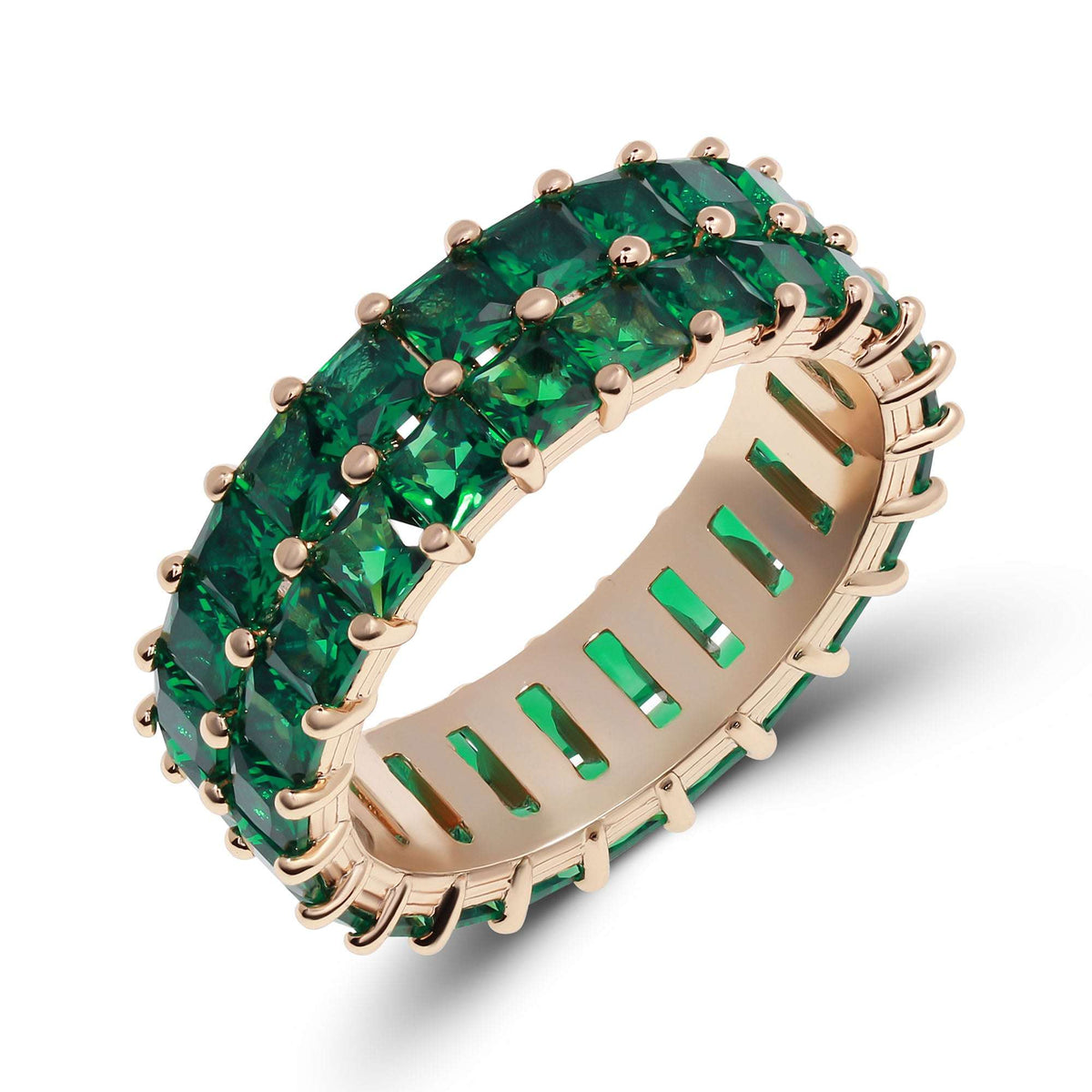 Gold-plated ring with two rows of square emerald green crystals, angled view on white