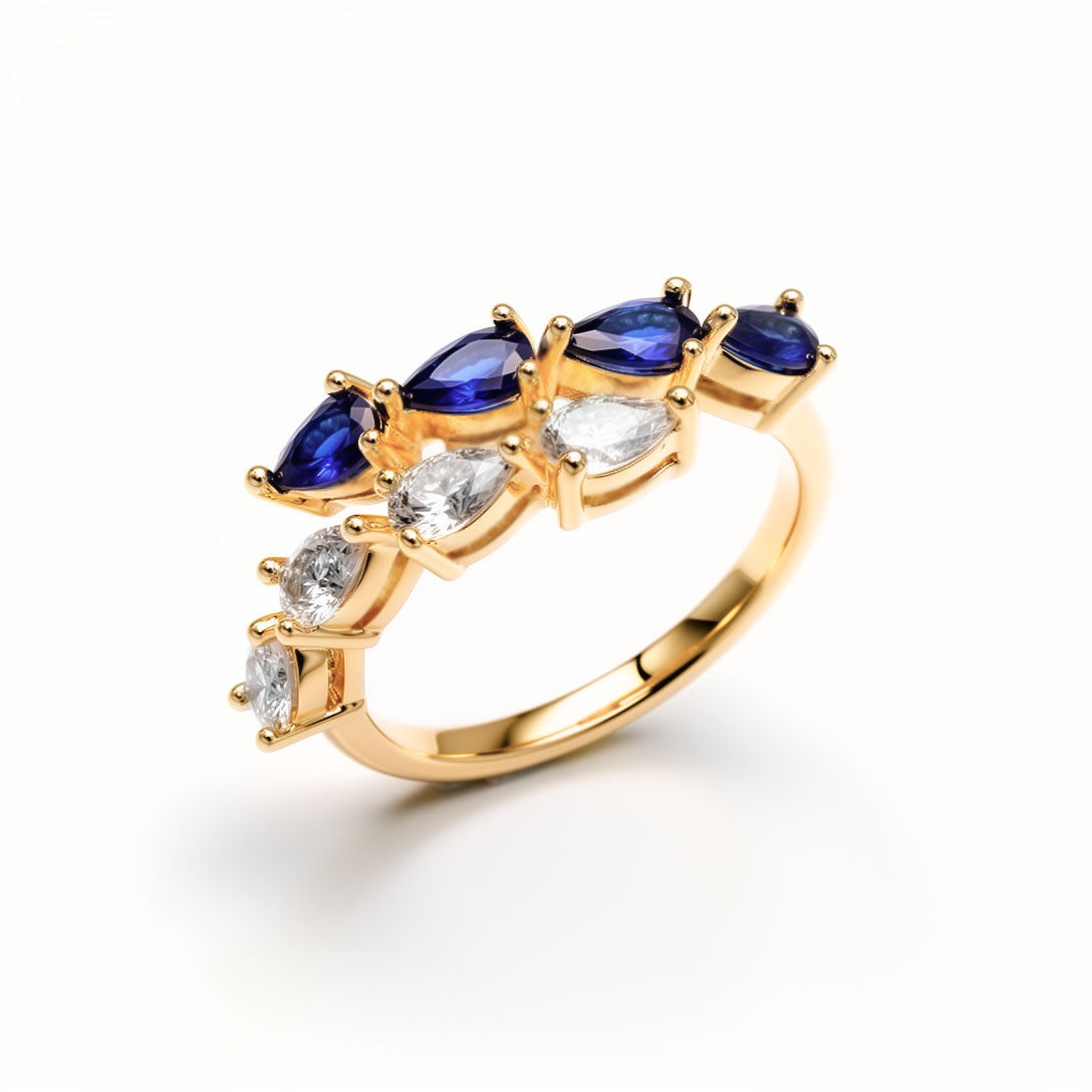 Open ring with blue and clear teardrop cubic zirconia in gold plating