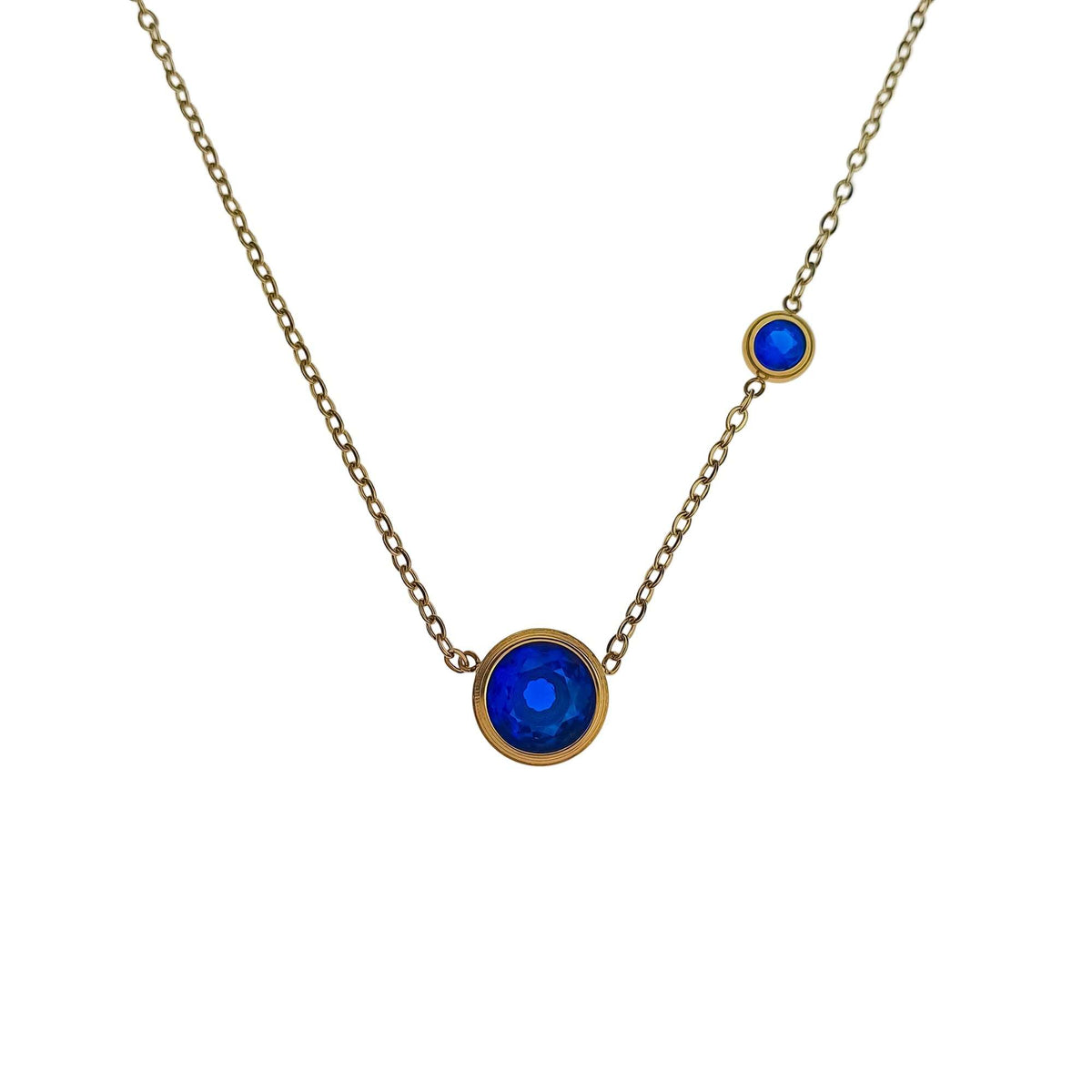 Gold-plated necklace with a large bright blue cubic zirconia and smaller blue stone