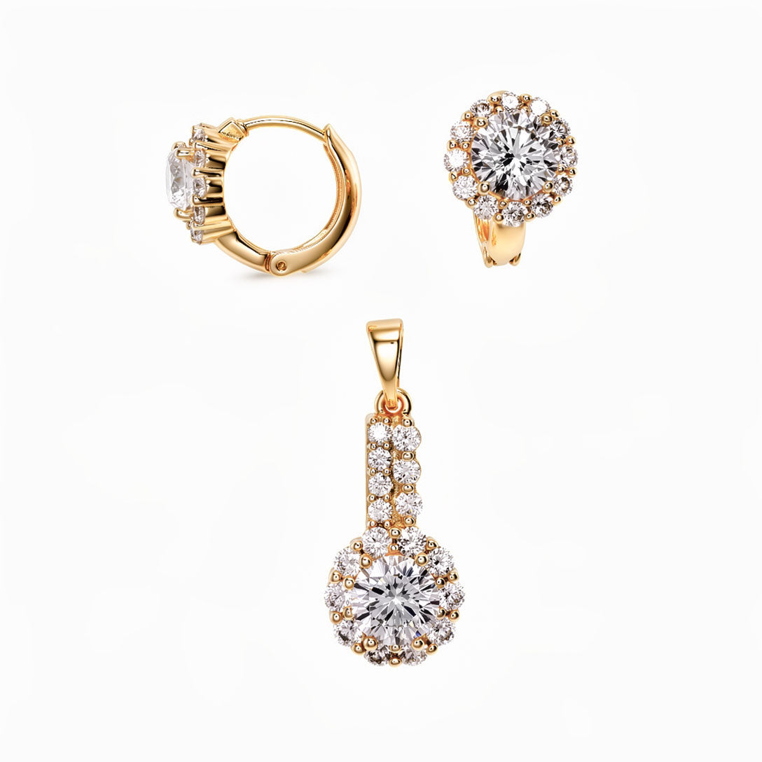 Gold-plated set of cubic zirconia hinged hoop earrings and matching pendant on white